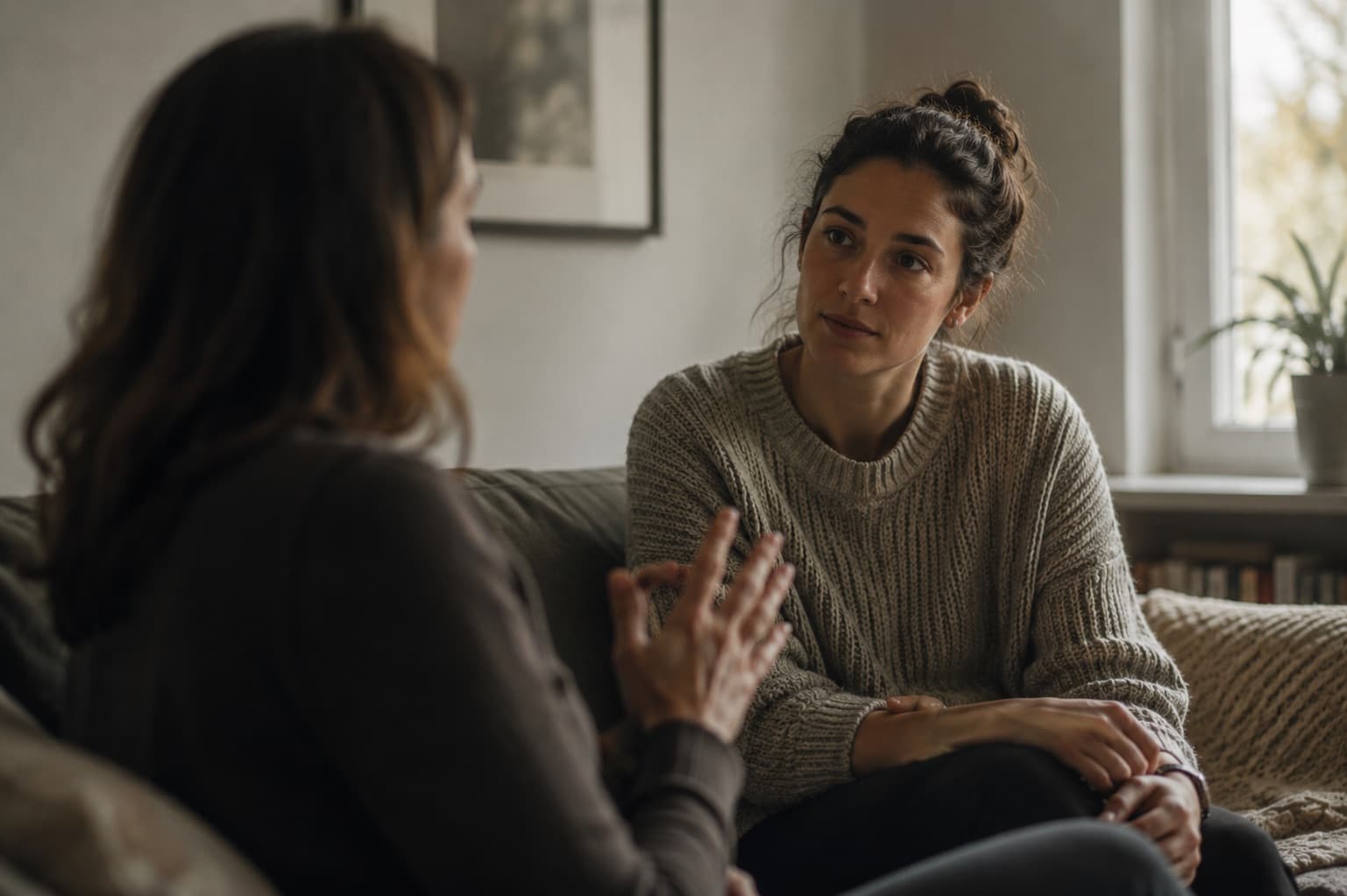 Two people sitting together in a moment of support